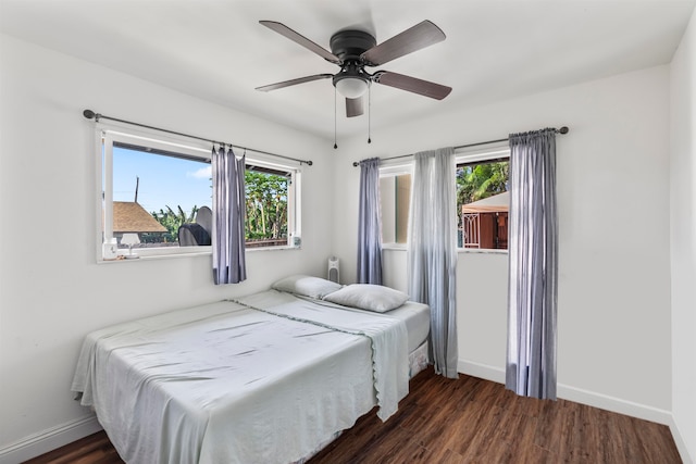 bedroom featuring ceiling fan and dark hardwood / wood-style floors