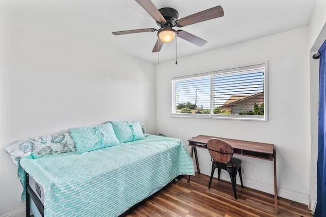 bedroom featuring dark wood-type flooring and ceiling fan