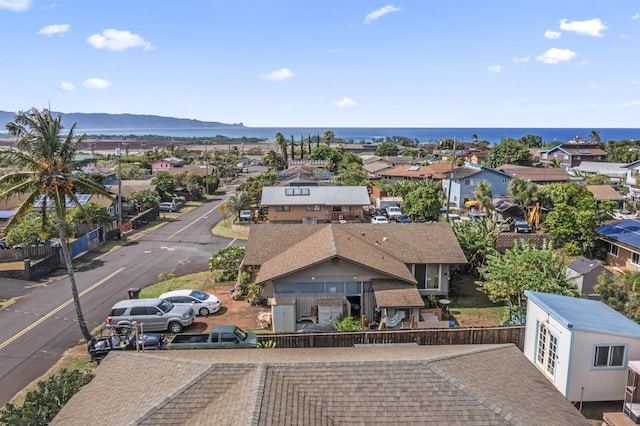 bird's eye view with a residential view and a water and mountain view