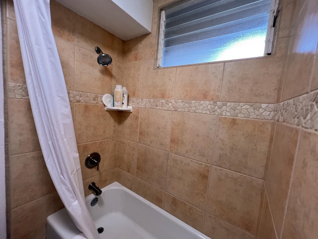 bathroom featuring shower / tub combo with curtain