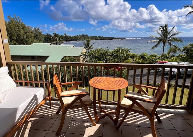 balcony featuring a water view