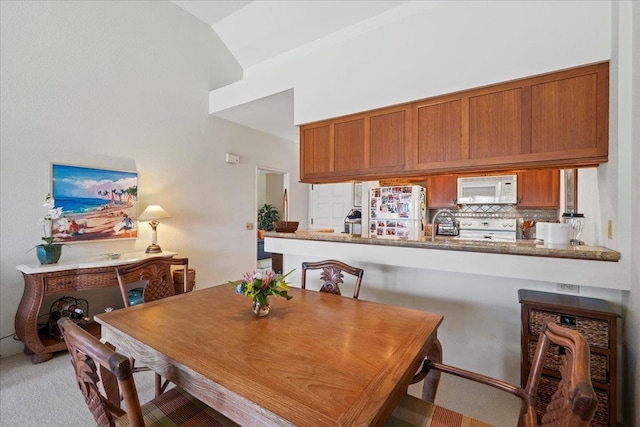 dining area with carpet