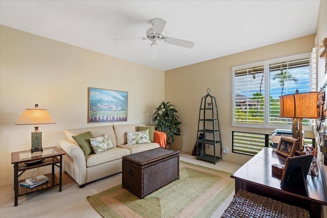 living room featuring ceiling fan and light carpet