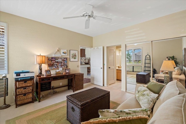 living room featuring ceiling fan and light carpet