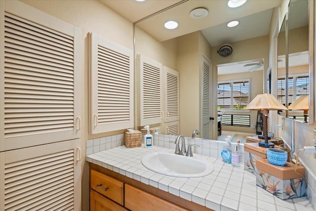 bathroom with vanity and ceiling fan