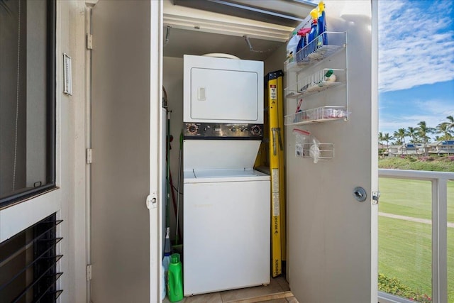 laundry area with stacked washer / drying machine