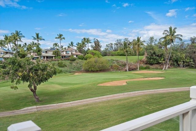 view of home's community with a yard