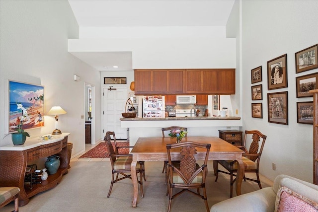 dining room with a high ceiling