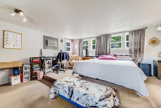 2120 Onaona St, Wailuku, HI 96793 - bedroom featuring carpet, a textured ceiling, and an AC wall unit