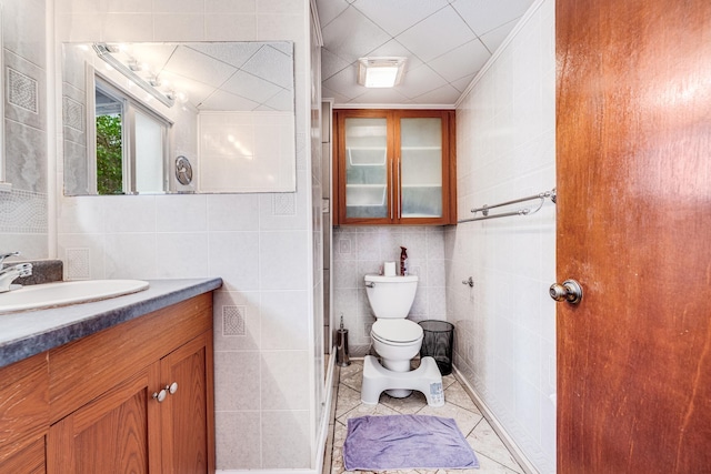 2120 Onaona St, Wailuku, HI 96793 - bathroom with tile walls, vanity, toilet, and tile patterned flooring