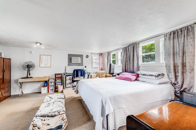2120 Onaona St, Wailuku, HI 96793 - bedroom with carpet floors, a wall unit AC, and a textured ceiling