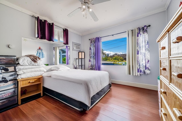 2120 Onaona St, Wailuku, HI 96793 - bedroom with ornamental molding, wood finished floors, baseboards, a ceiling fan, and a wall mounted air conditioner