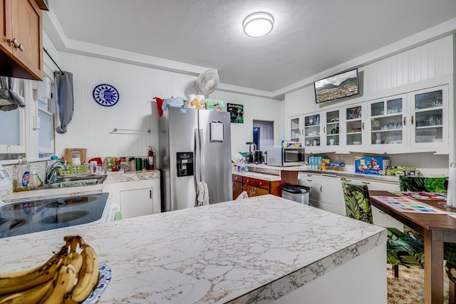 2120 Onaona St, Wailuku, HI 96793 - kitchen featuring stainless steel appliances, light countertops, glass insert cabinets, and a sink