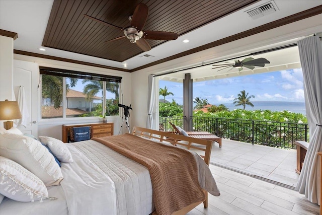 bedroom with ceiling fan, a water view, access to outside, and multiple windows