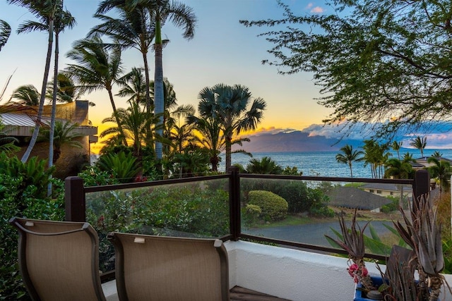 balcony at dusk with a water view