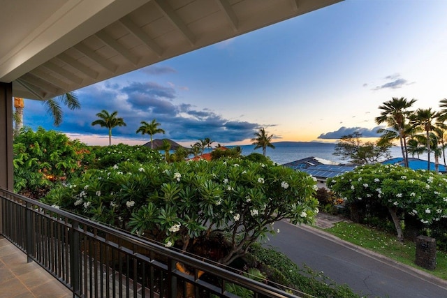 balcony at dusk with a water view