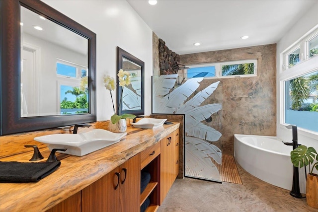 bathroom with vanity and a bathtub