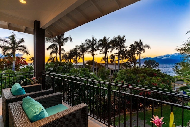 view of balcony at dusk