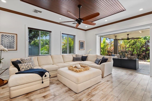 living room with ceiling fan, crown molding, and wooden ceiling