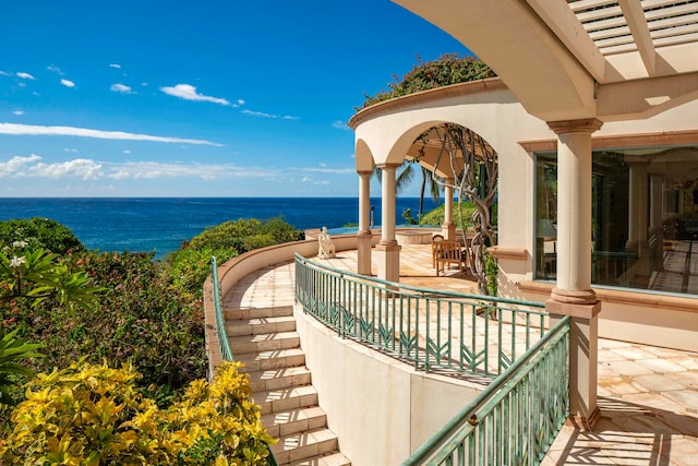 view of patio featuring a water view