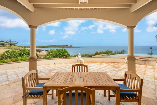 view of patio featuring a water view