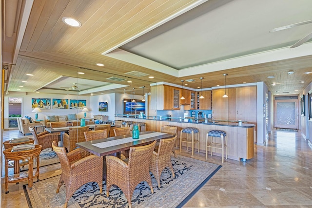160 Pualei Dr Unit 160-4, Lahaina, HI 96761 - dining area featuring recessed lighting, a ceiling fan, a raised ceiling, and light marble finish floors