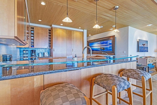 160 Pualei Dr Unit 160-4, Lahaina, HI 96761 - kitchen featuring wooden ceiling, backsplash, recessed lighting, dark stone countertops, and pendant lighting