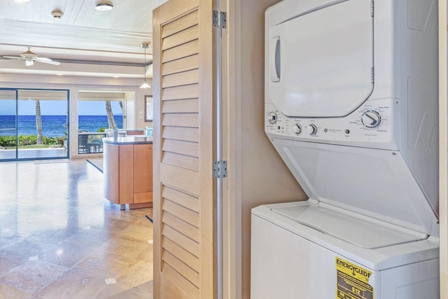 160 Pualei Dr Unit 160-4, Lahaina, HI 96761 - clothes washing area featuring stacked washer / drying machine, a water view, and ceiling fan