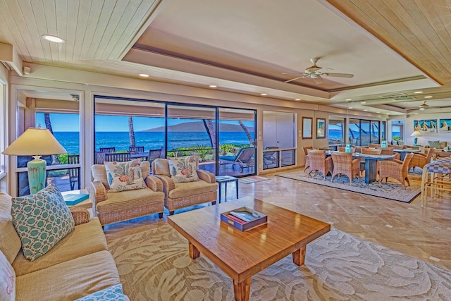 160 Pualei Dr Unit 160-4, Lahaina, HI 96761 - living room featuring ceiling fan, a tray ceiling, a water view, and recessed lighting