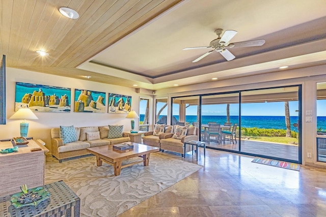 160 Pualei Dr Unit 160-4, Lahaina, HI 96761 - living room with a water view, recessed lighting, ceiling fan, and a raised ceiling