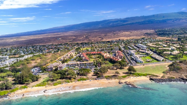 bird's eye view featuring a view of the beach and a water and mountain view