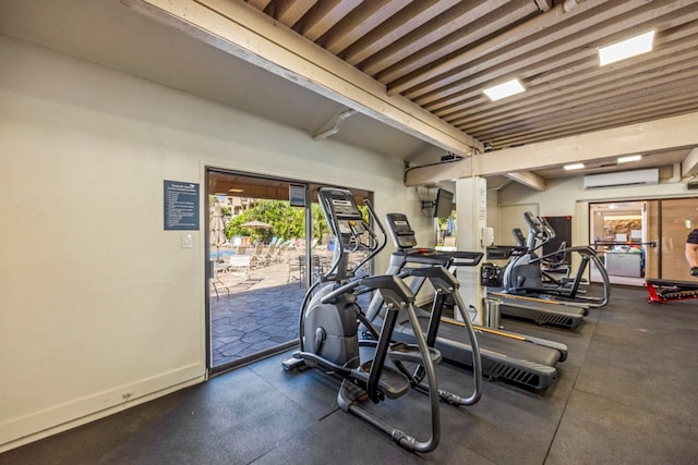 exercise room featuring an AC wall unit