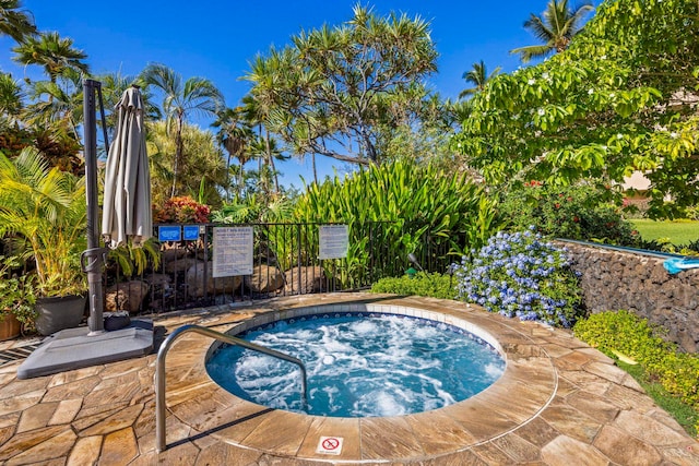 view of pool with a community hot tub