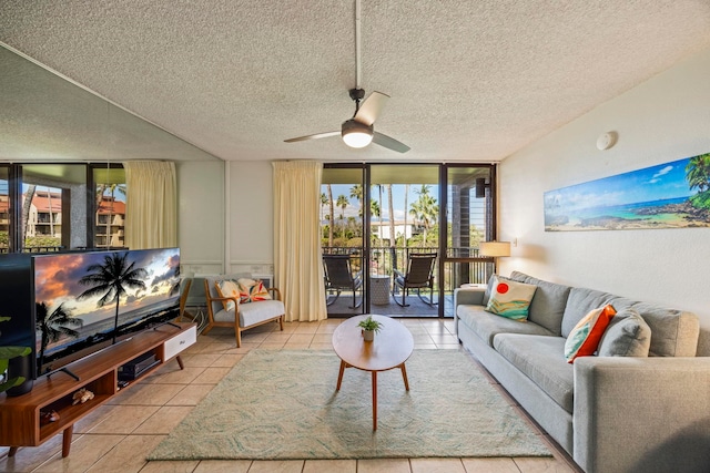 tiled living room featuring a textured ceiling, a wall of windows, and ceiling fan