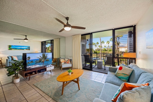 tiled living room featuring floor to ceiling windows, ceiling fan, and a textured ceiling