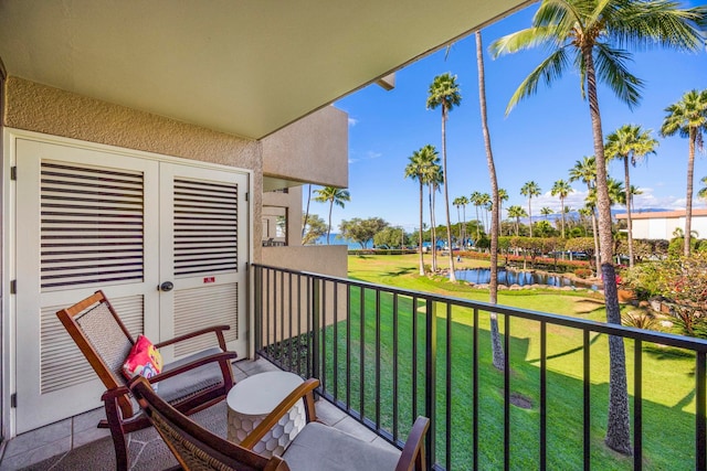 balcony featuring a water view