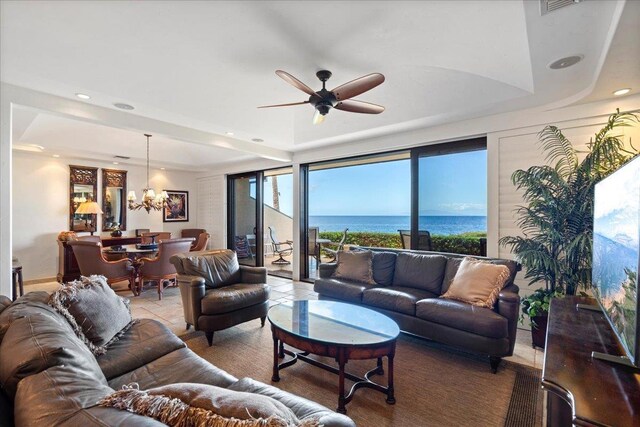4850 Makena Alanui Rd Unit F-108, Kihei, HI 96753 - living area with ceiling fan with notable chandelier, a raised ceiling, and recessed lighting