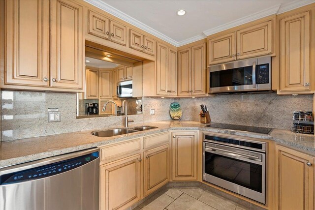 4850 Makena Alanui Rd Unit F-108, Kihei, HI 96753 - kitchen with light tile patterned floors, appliances with stainless steel finishes, a sink, light stone countertops, and backsplash
