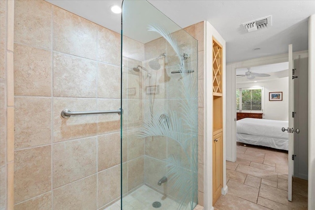 4850 Makena Alanui Rd Unit F-108, Kihei, HI 96753 - full bathroom featuring stone tile floors, ensuite bath, a ceiling fan, visible vents, and walk in shower