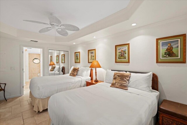 4850 Makena Alanui Rd Unit F-108, Kihei, HI 96753 - bedroom with recessed lighting, visible vents, a tray ceiling, stone tile flooring, and crown molding