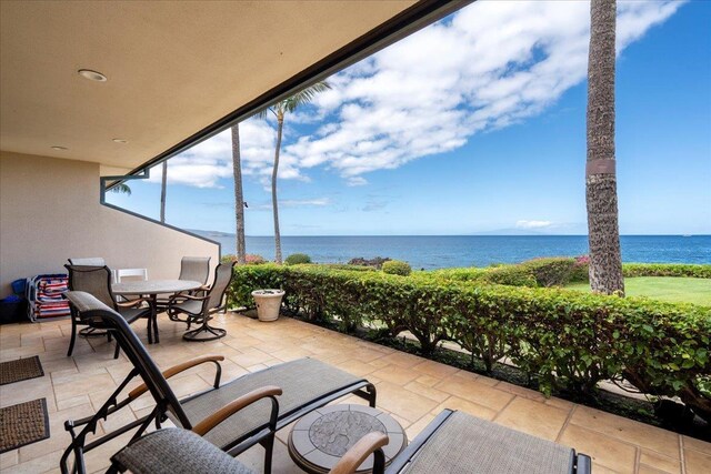 4850 Makena Alanui Rd Unit F-108, Kihei, HI 96753 - view of patio featuring outdoor dining area and a water view