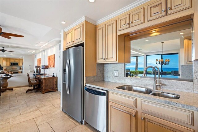 4850 Makena Alanui Rd Unit F-108, Kihei, HI 96753 - kitchen featuring tasteful backsplash, appliances with stainless steel finishes, open floor plan, decorative light fixtures, and a sink