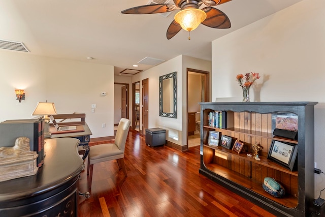 office space featuring ceiling fan and dark hardwood / wood-style flooring