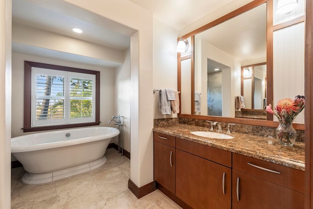 bathroom featuring a tub and vanity