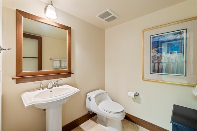 bathroom featuring toilet