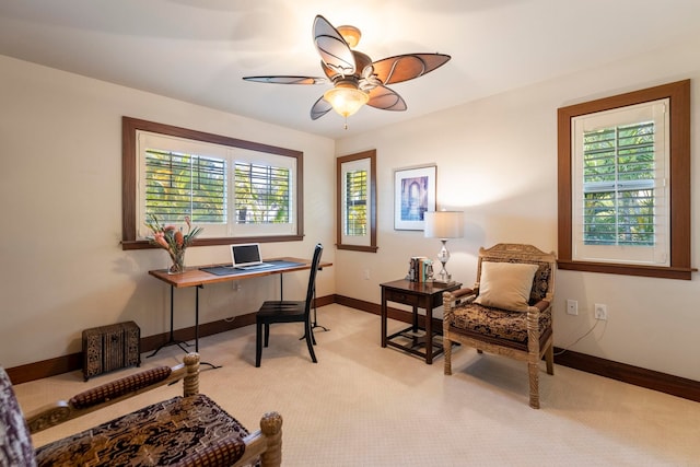 office featuring ceiling fan and light carpet