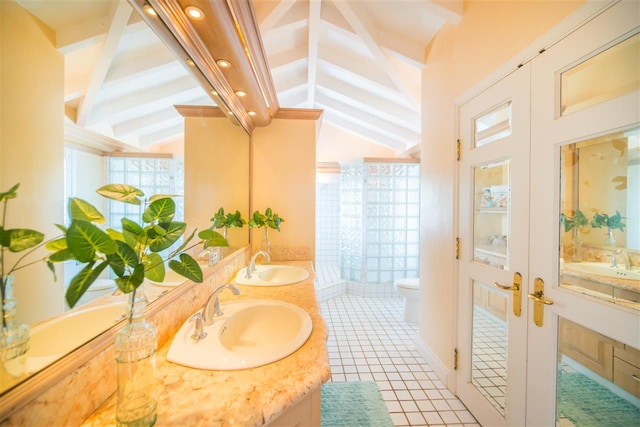 bathroom featuring french doors, tile patterned floors, lofted ceiling, and toilet