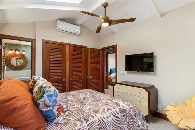 bedroom featuring ceiling fan, a closet, lofted ceiling with beams, and a wall mounted AC