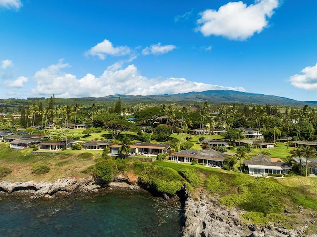 birds eye view of property featuring a water and mountain view
