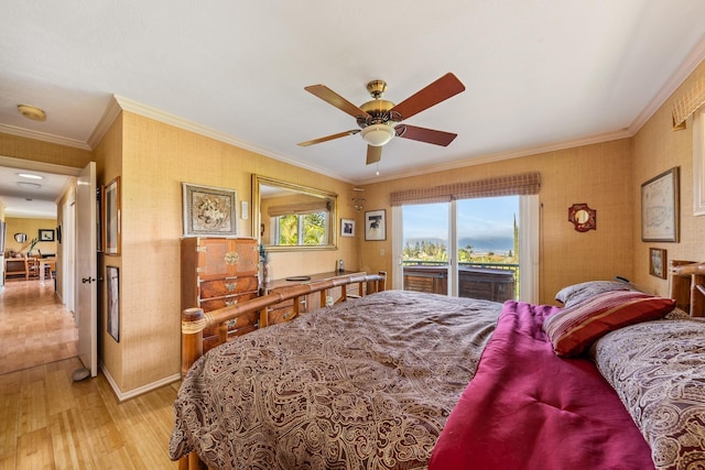 bedroom featuring ceiling fan, access to exterior, ornamental molding, and hardwood / wood-style floors